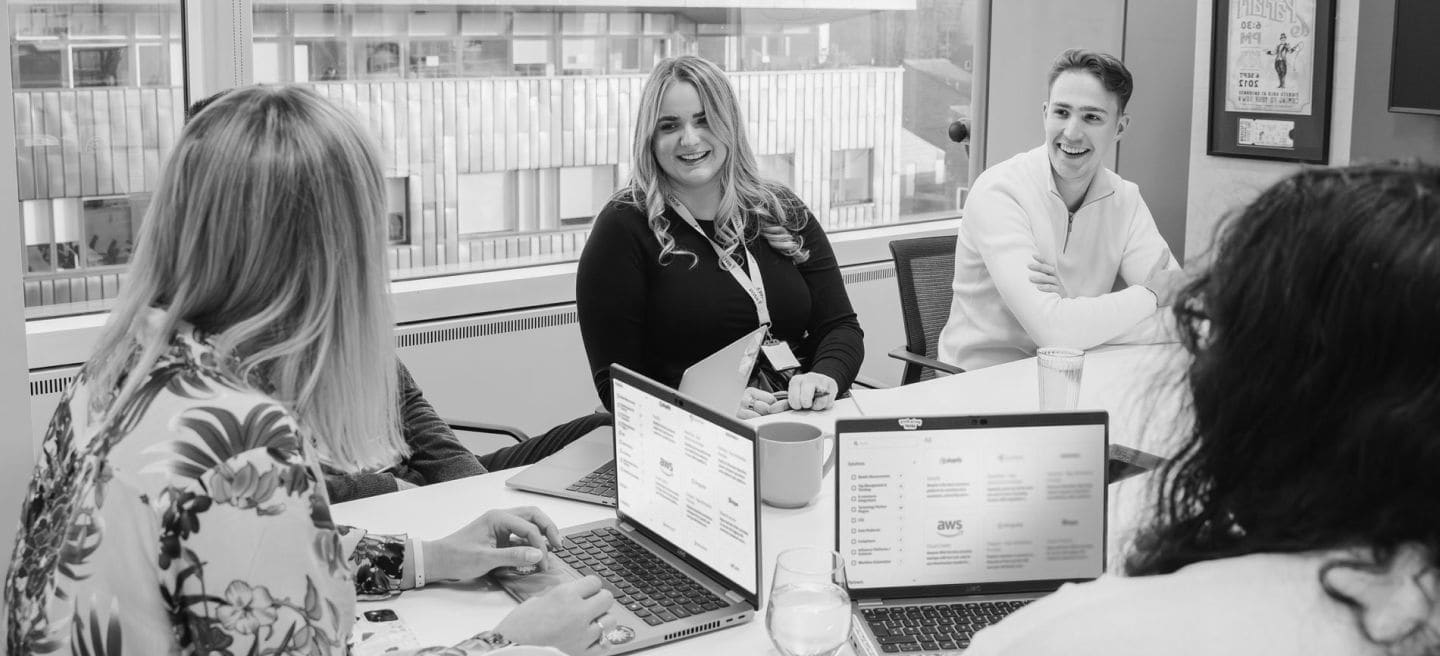 Awin colleagues in the London office discussing technology partnerships