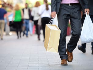 Man holding shopping bags affiliate singles day