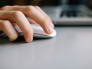 hand on computer mouse