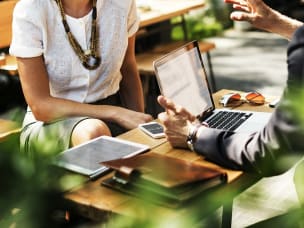 man and woman having meeting on laptop