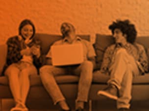 people sitting on a sofa and conversing