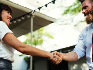 man and woman shaking hands