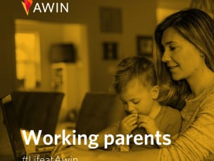 Working parents at Awin looking at a laptop together — #LifeatAwin