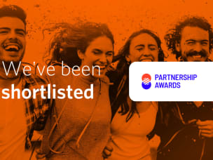 Banner with an orange background featuring four people and the message: 'We have been shortlisted