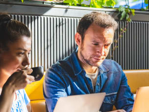 People looking at the digital marketing challenge of Ad-blocking software and its future impact