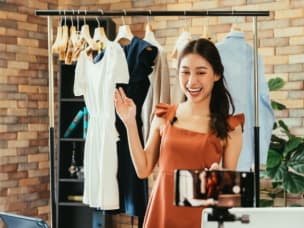 Influencer recording content amid the influencer marketing industry now being worth $24 billion