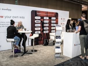 Four people, two of them being Awin's representatives, networking at Partnerships Week 2024 in Las Vegas