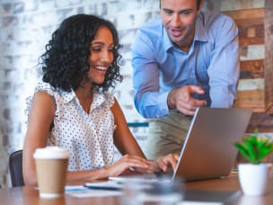 Two people collaborating at desk