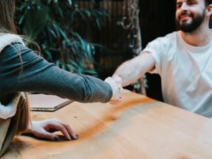 Man and woman shaking hands