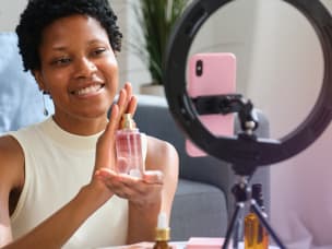 Creator filming a product demo on a phone at home