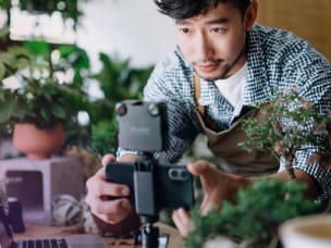 Creator filming a product on a phone at home