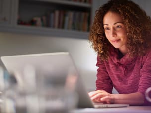 Person browsing a Facebook group on a laptop