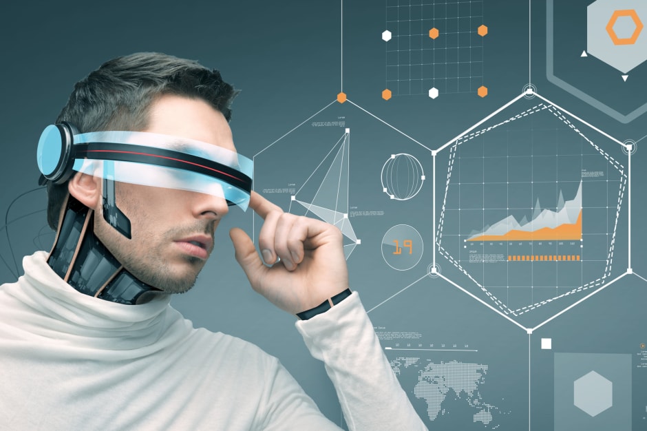 An image of a man using an animiated high-tech headset against a backdrop of graphs, facts and figures connoting sector trends.