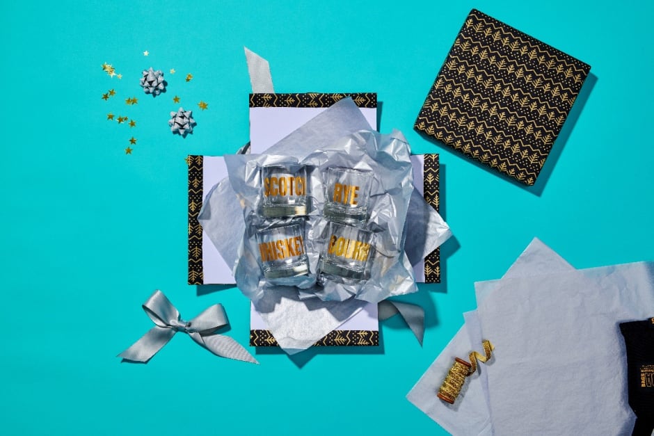 Unwrapped gift lying on blue background