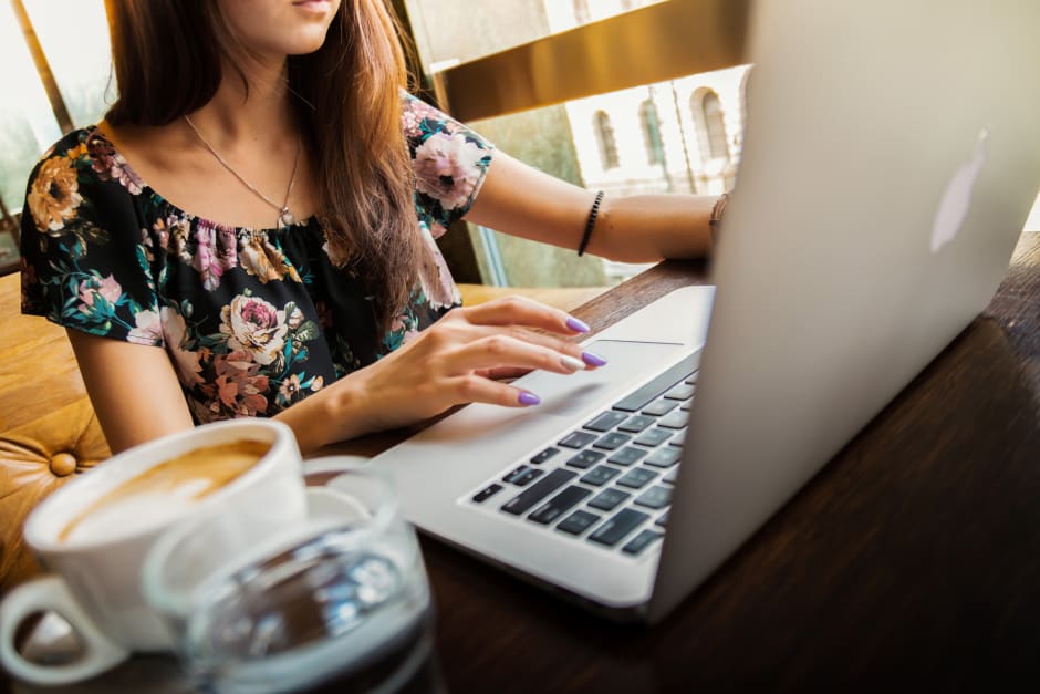 Girl with coffee and laptop