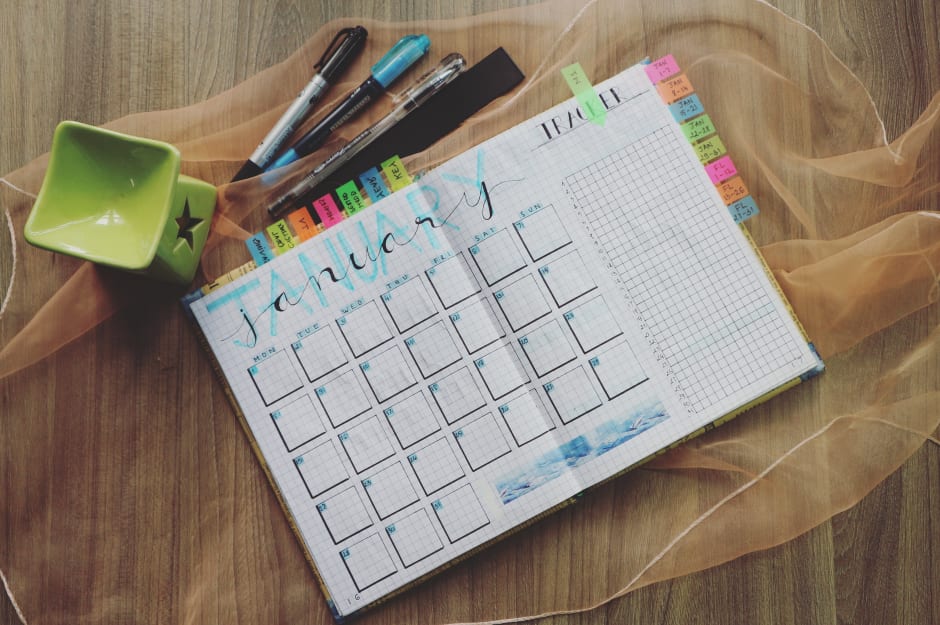 Notebook with calendar for January to make new year's resolutions