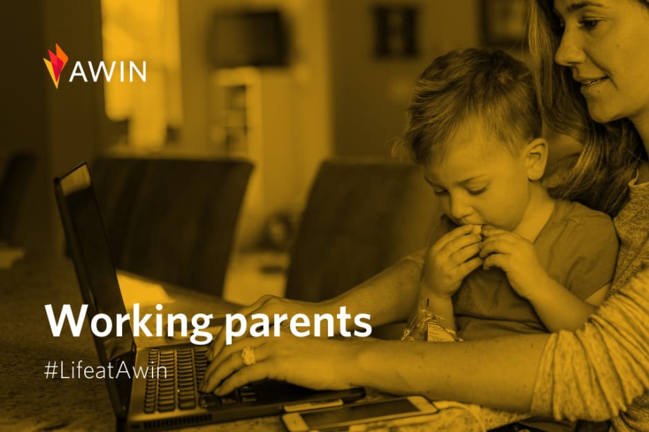 Working parents at Awin looking at a laptop together — #LifeatAwin