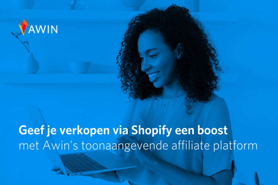 Person holding a laptop with Awin and Shopify affiliate message on blue background.
