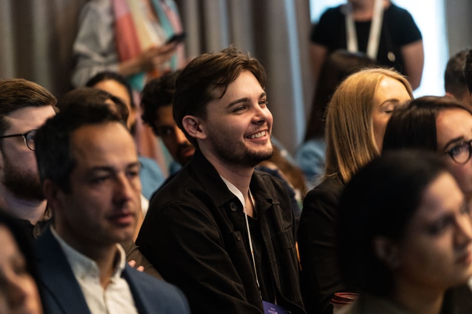 Guests attending London ThinkTank 2023, highlighting cheerful person in the centre