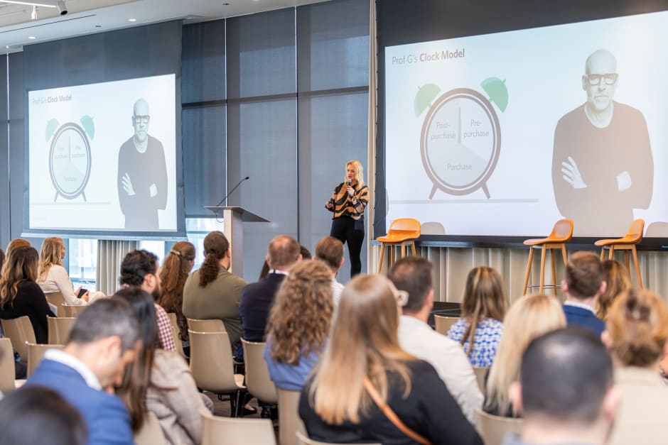 A speaker on stage with an audience watching at the Awin and ShareASale ThinkTank