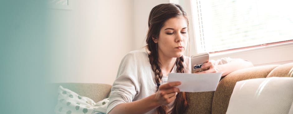 Women checking her marketing budget, amid staying ahead in cost-of-living crisis with Awin's retail hacks