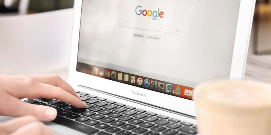 Person on their laptop on Google amid websites significantly losing rankings in Google’s search engine results pages (SERPs)