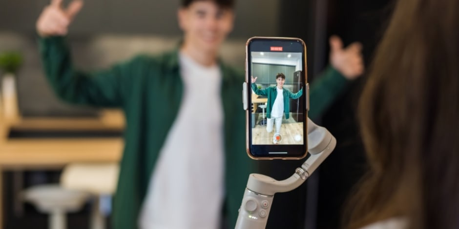 Influencer recording a video amid growing their reach by incorporating affiliate marketing