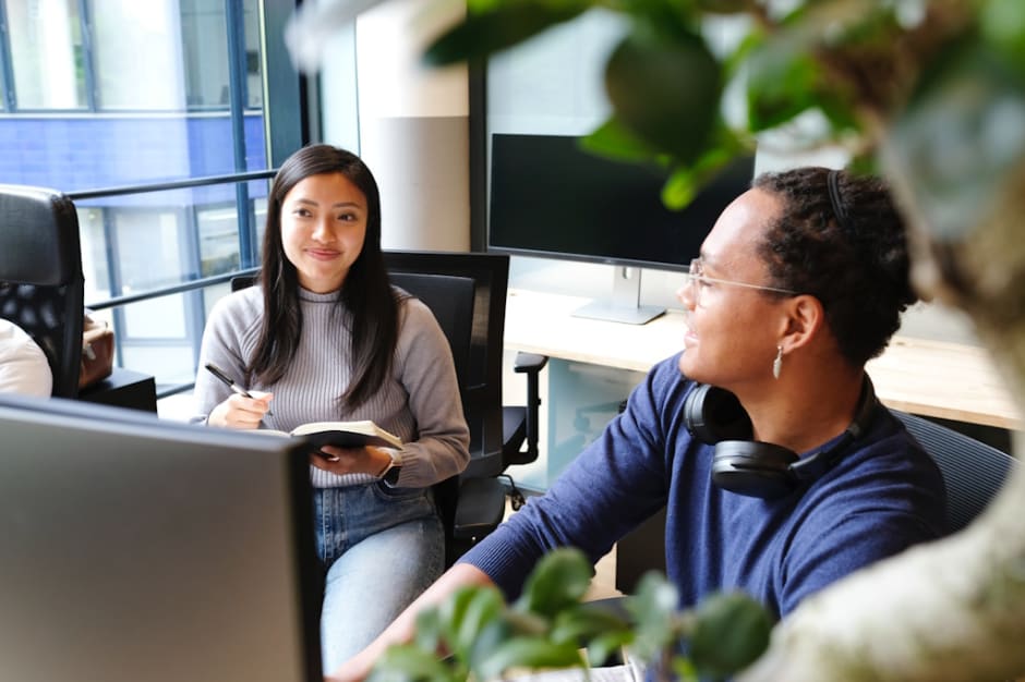 Two people in office, informing themselves about GDPR and ePrivacy guidelines provided by Awin
