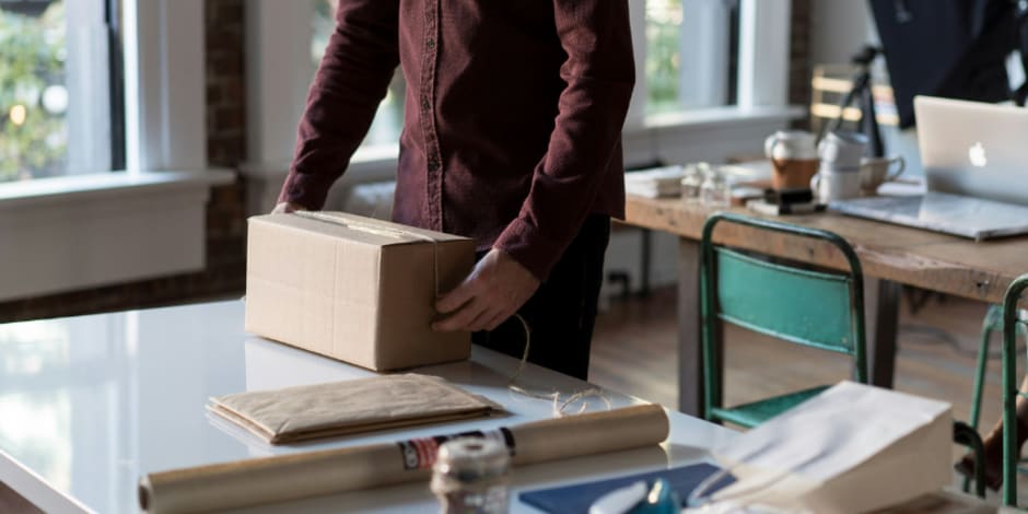 Small business employee preparing parcel for shipping amid how effective digital marketing is for growth
