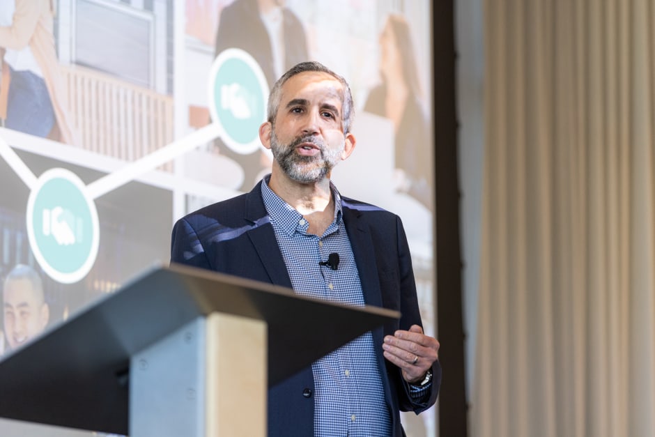 Adam Weiss, Awin Group President North America, answers all ShareASale questions, standing on stage