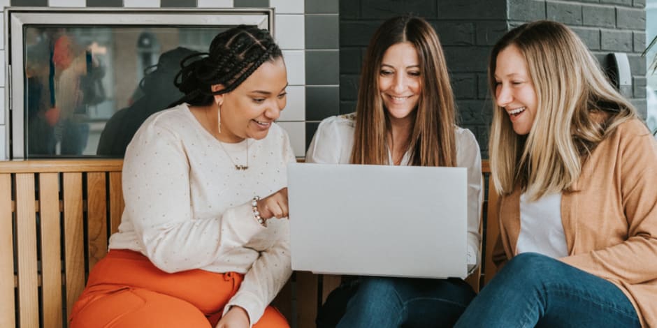 People around a laptop