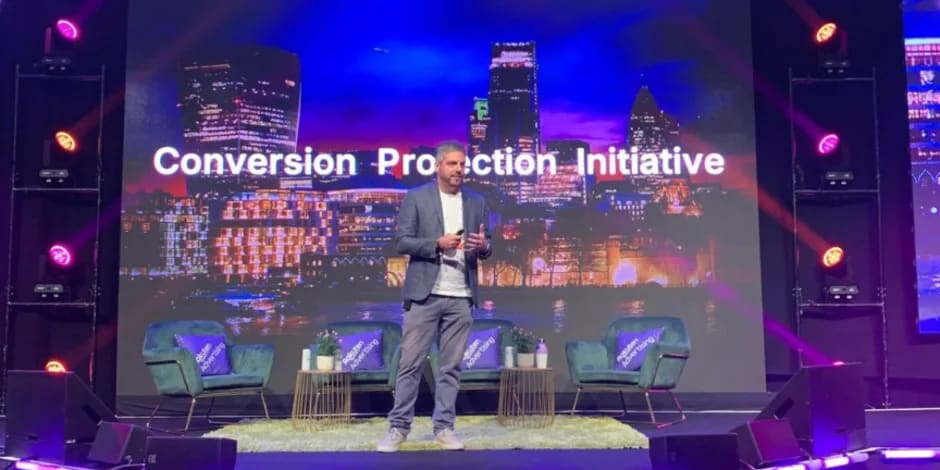  Awin's CEO, Adam Ross, on stage presenting the Conversion Protection Initiative at PI Live Europe.