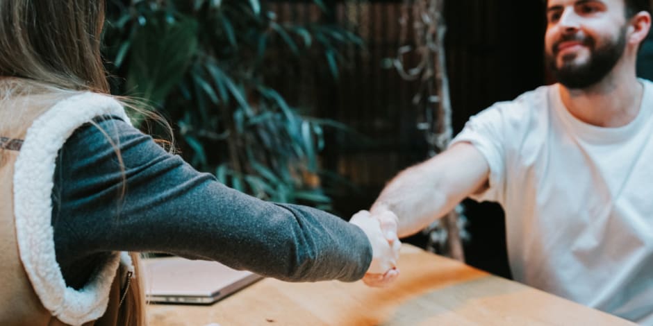 Man and woman shaking hands