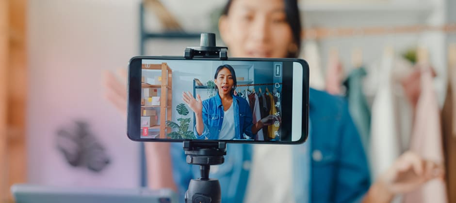 Creator filming a product review on a phone