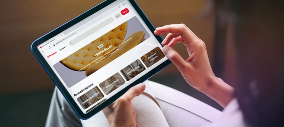 Person browsing a Pinterest home decor board on a tablet