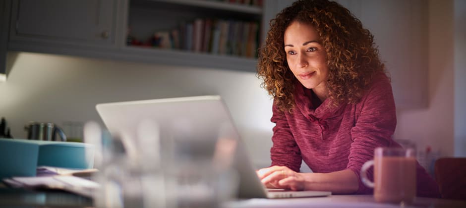 Person browsing a Facebook group on a laptop